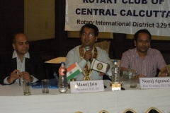 Presiding over Rotary Club meeting